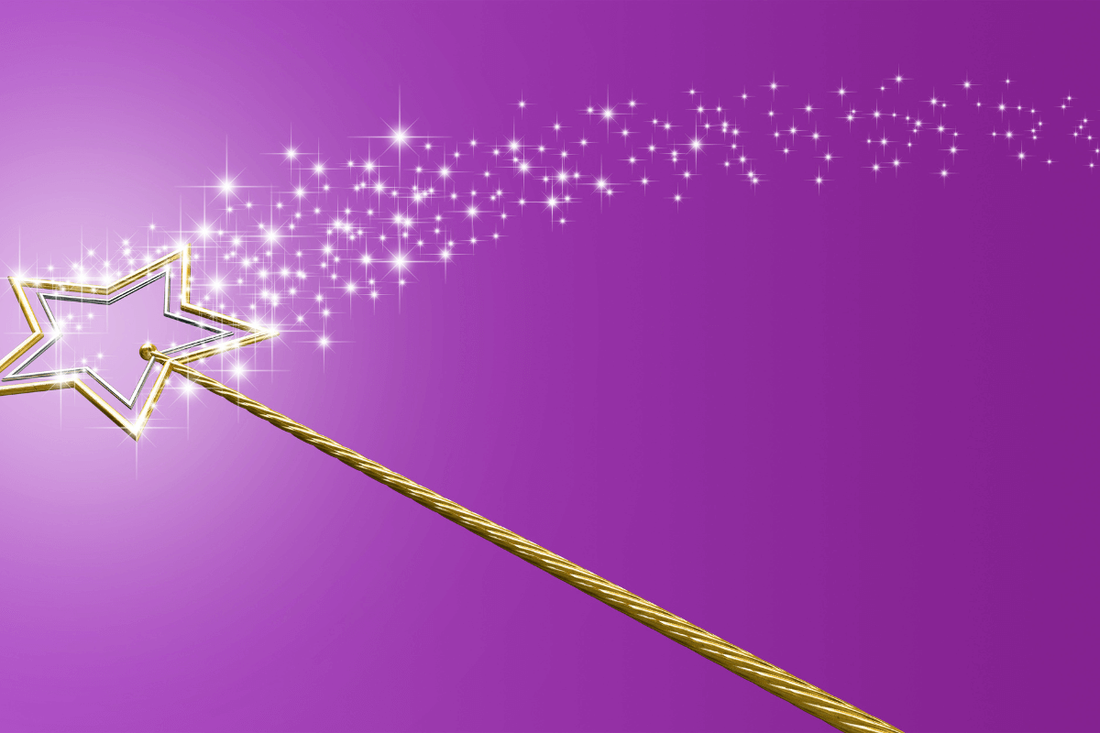 The picture of a gold magic wand on a purple background. Representign the power of making a wish.