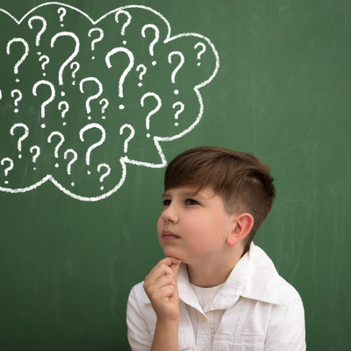 boy with a thought bubble containing question marks